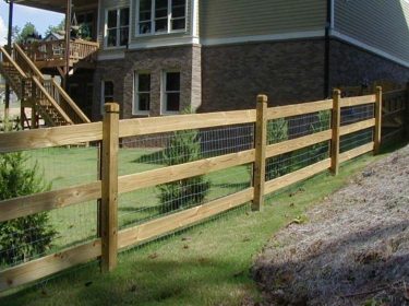A wood fence enclosing a yard